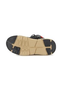 Suola di scarpa atletica nera con superficie testurizzata, caratterizzata da una intersuola beige e dettagli in gomma nera, progettata per trazione e supporto.