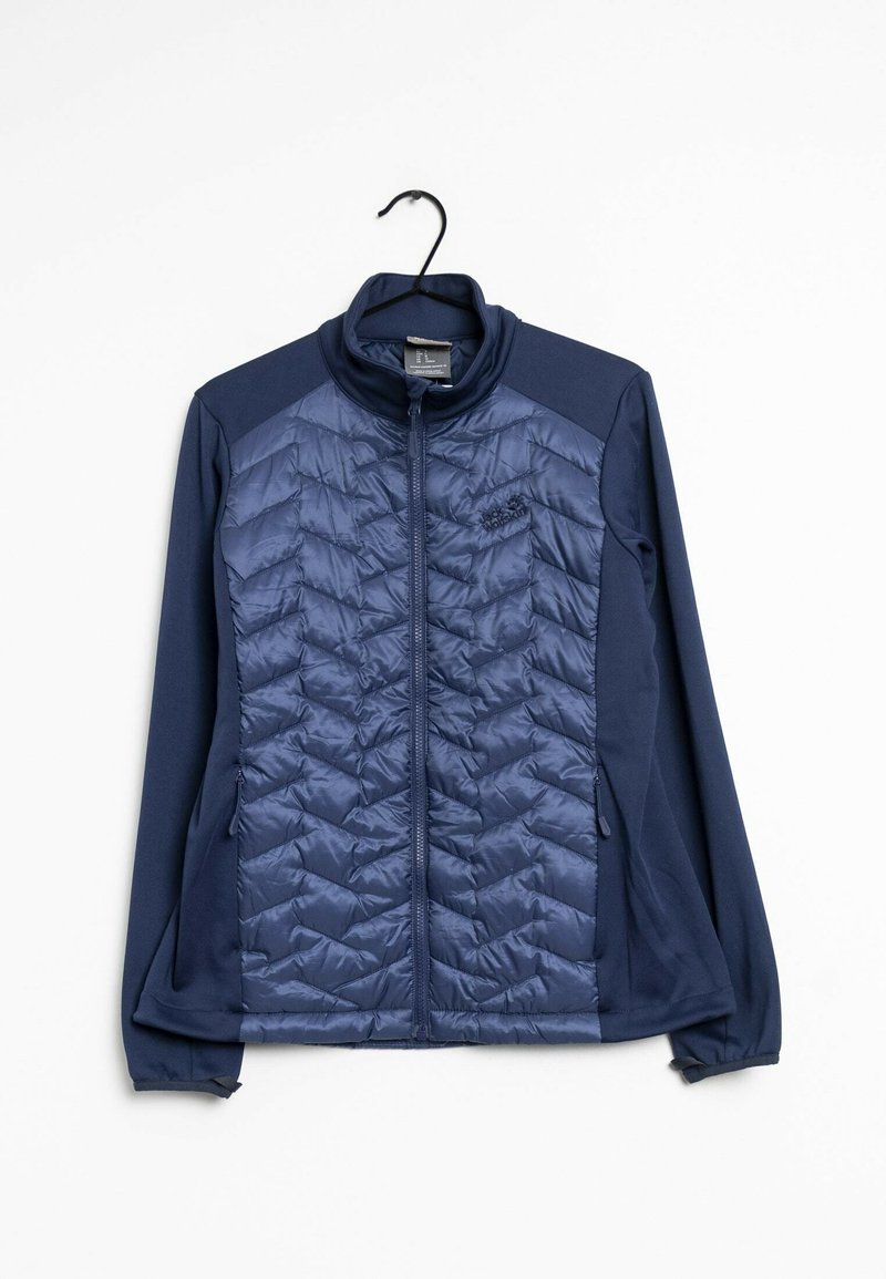 Veste bleu marine zippée intégrale avec panneau avant matelassé et manches en tissu doux, suspendue à un cintre noir sur fond blanc.