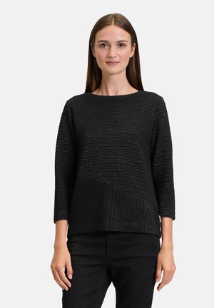 Black sweater with a textured striped design and three-quarter sleeves, featuring an asymmetrical hemline and subtle shimmer details.
