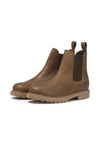 Bottines Chelsea en cuir marron avec des panneaux latéraux élastiques, des languettes de traction et une semelle extérieure robuste. Présentent une texture lisse et une semelle en caoutchouc solide.