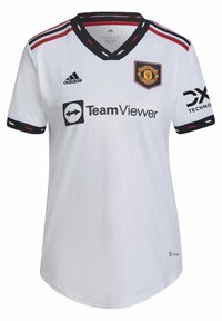 Camiseta blanca del Manchester United con detalles en negro, cuello en V y rayas rojas. Muestra los logotipos de: Adidas, TeamViewer y DX Technology.