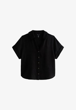 Chemise noire à manches courtes avec col, boutons sur le devant et poignets retroussés, coupe ample, tissu léger.