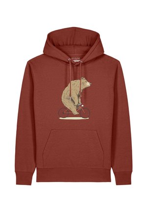Sweat à capuche couleur rouille avec un graphique représentant un grand ours roulant à vélo rouge à l'avant. Des cordons pendent de la capuche.