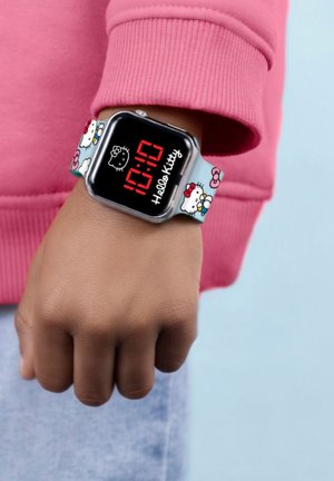 Orologio digitale con schermo nero che mostra l'ora in rosso, dotato di un cinturino blu con illustrazioni di Hello Kitty e accenti floreali.