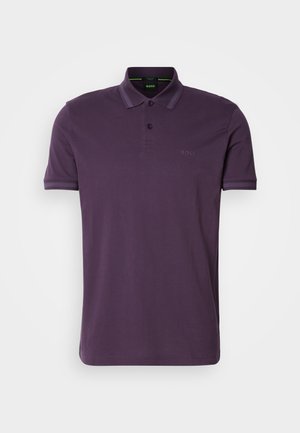 Purple polo shirt made of cotton with a collared neck, three-button placket, and subtle logo detail. Short sleeves with contrasting accents.