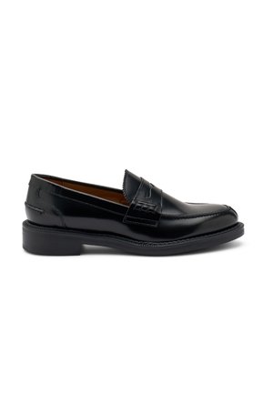 Black leather loafers with a smooth finish, stitched detailing, and a low rubber sole. Features a decorative strap across the upper.