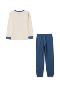 Blusa de manga larga color crema con puños azules y pantalones marinos a juego que presentan un diseño bordado en la parte inferior de la pierna. Material de algodón suave.