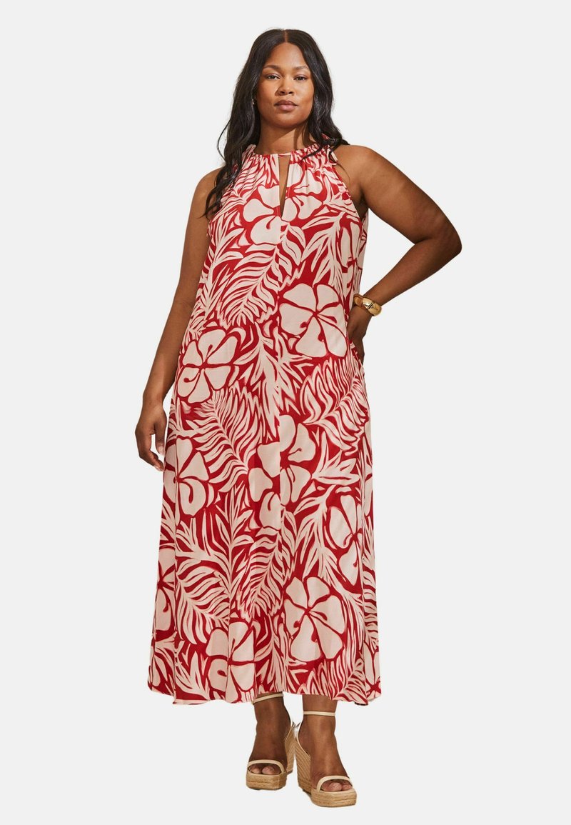 Röd och vit tropisk mönstrad maxiklänning med nyckelhålsknäppning, voluminös form och slät textur. Bärs med sandaler med remmar.