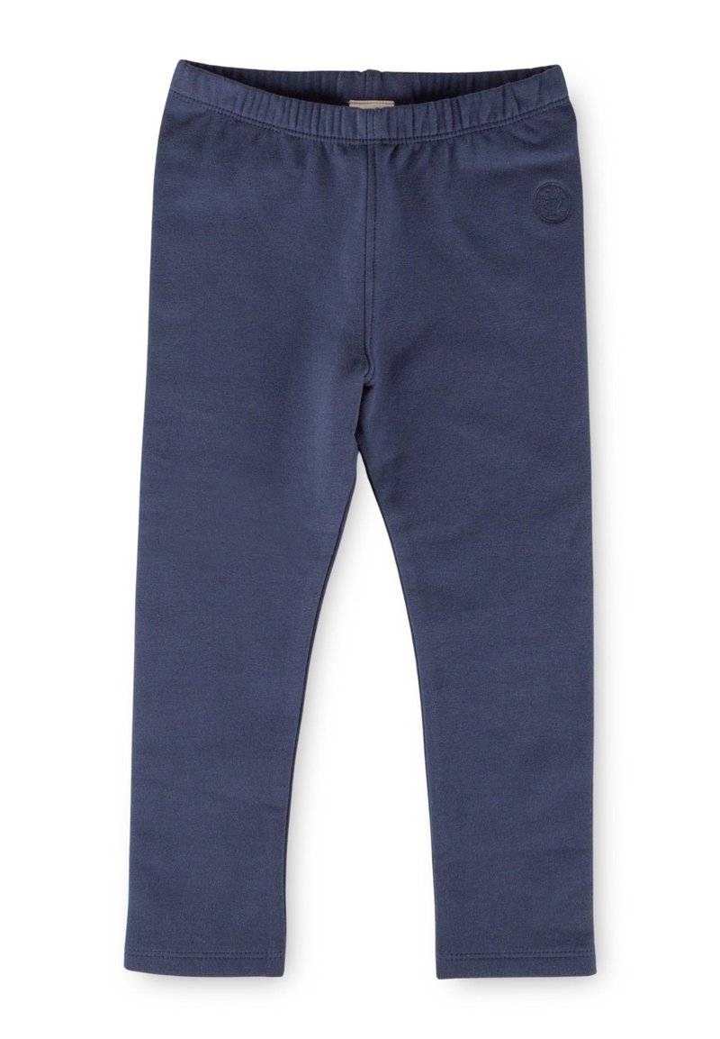 Leggings bleu marine avec une ceinture élastique, fabriqués en tissu lisse et extensible, présentant un petit logo en relief sur un côté.