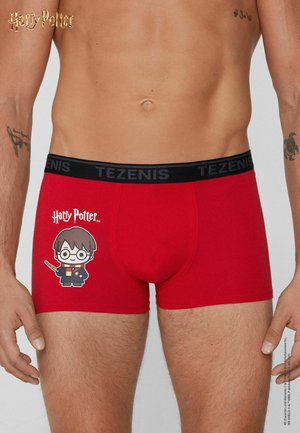 Red boxer briefs with black waistband labeled "TEZENIS," featuring a cartoon Harry Potter holding a wand and the Harry Potter logo on the left thigh.