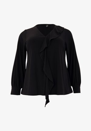 Haut noir à manches longues avec un décolleté en V, volants asymétriques à l'avant et manches à poignets, fabriqué en tissu doux.