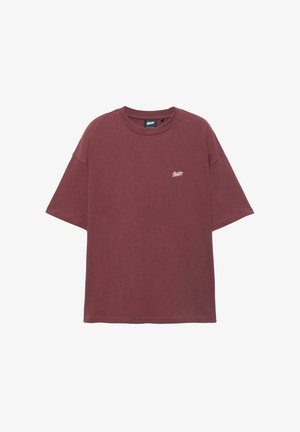 Bordeauxfarbenes Baumwoll-T-Shirt mit rundem Ausschnitt und kurzen Ärmeln. Es verfügt über ein kleines weißes Logo auf der oberen linken Brustpartie.