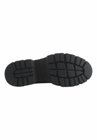 Sole in gomma nera con un motivo di battistrada testurizzato e dettagli scanalati distintivi per una maggiore aderenza e trazione. Design piatto e ampio.