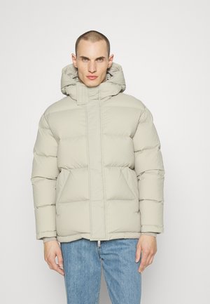 Light grey puffer jacket with a high collar, hood, and horizontal quilted design. Features front zip closure and side pockets.
