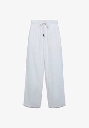 Pantaloni bianchi a taglio ampio con vita elastica e coulisse, gambe larghe e tessuto semplice e liscio.