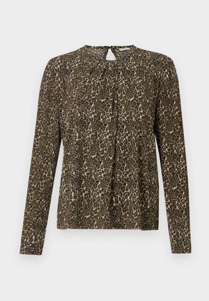 Blouse à imprimé léopard à manches longues avec une petite ouverture en forme de clé et des plis au niveau du col, présentée sur un fond blanc.