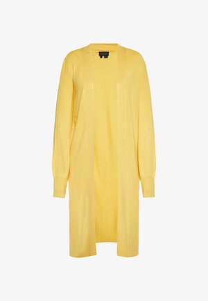 Sárga, hosszú kardigán, bordás textúrával, nyitott elülső résszel és hosszú ujjakkal. Könnyű anyagból készült a kényelem és az akár több rétegben való viselés érdekében.