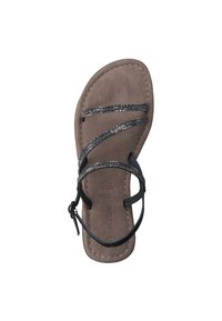 Sandale en cuir noir avec deux lanières ajustables et des strass décoratifs, reposant sur un semelle en suede brun. Design plat et ouvert à l'avant.