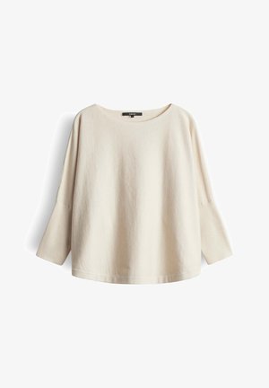 Haut à manches longues couleur crème avec un large col rond, doté d'un tissu doux et texturé et d'une coupe décontractée.