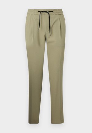 Khaki-byxor i ett mjukt tyg med avslappnad passform, featuring resårmidja och dragsko. Räta ben med sidofållar.