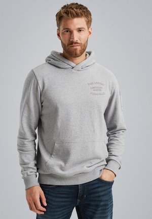 Gray hoodie with a kangaroo pocket, ribbed cuffs, and a hood. Features embroidered text and a plain, soft texture. Worn over dark jeans.