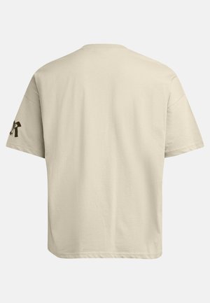 Beige cotton t-shirt with a relaxed fit, short sleeves, and a round neckline. Features a dark logo on the left sleeve.