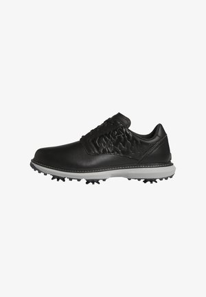 Chaussure de golf noire avec panneau latéral texturé, fermeture à lacets et semelle blanche équipée de crampons noirs pour une meilleure adhérence.