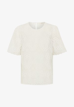 Bijela bluzica s vezom i kratkim rukavima, s okruglim izrezom i dekorativnim izrezanim uzorcima po cijeloj površini. Otvor na leđima ostaje jednostavan.