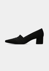 Black suede block-heeled pumps with a pointed toe and subtle horizontal pleats across the front. Smooth texture and clean lines.