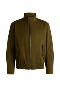 Olive green jacket with a high collar, front zipper, and two side pockets. Material appears smooth with elastic waistband and cuffs.