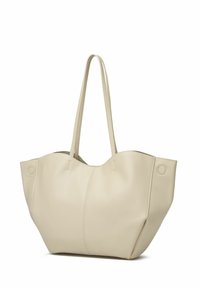 Geantă tote bej din piele sintetică texturată, cu două mânere lungi. Formă rotundă, accente cusute și detalii circulare din metal.