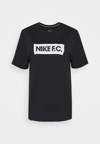 Sort bomulds T-shirt med korte ærmer, der har et hvidt "NIKE F.C." logo trykt tydeligt på fronten. Klassisk rund halsudskæring.