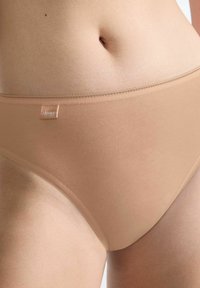 Beige women's cotton bikini briefs with a smooth texture, elastic waistband, and a small logo tag on the front left side.