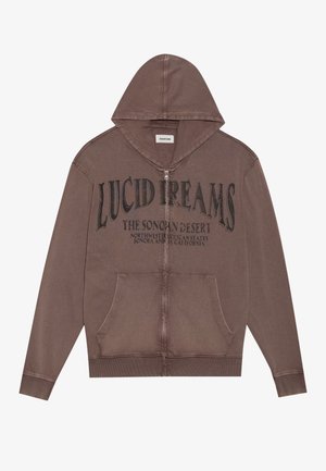 Felpa con zip marrone, dotata di tasca a marsupio frontale e stampa nera "LUCID DREAMS" sul davanti. Presenta un cappuccio foderato e polsini a costine.