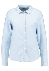 Ljusblå långärmad skjorta med knäppning i ett mjukt tyg, med en klassisk krage och sju framknappar, samt rundad fåll.