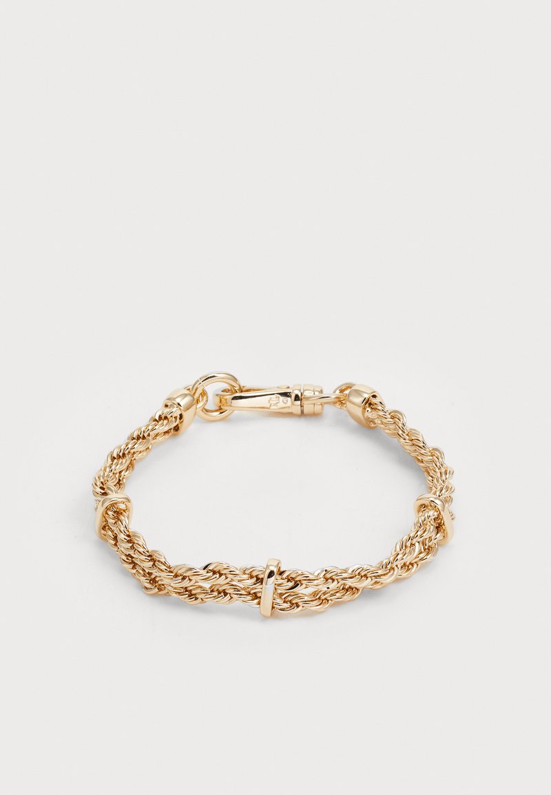 Zlatno-bronasti pleteni metalni zapestnica z teksturirano površino, ki vsebuje okrogle detajle in varen mehanizem zaponke.