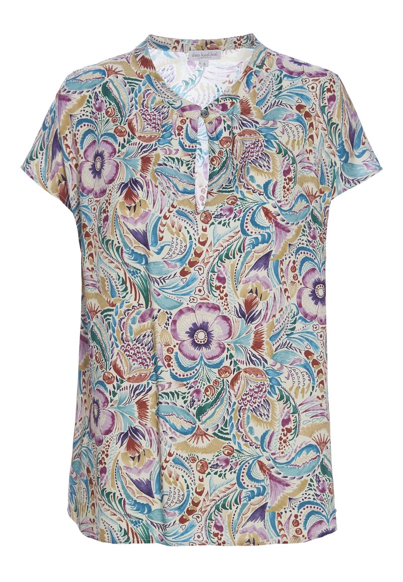 Blouse à manches courtes avec motifs floraux et feuillages multicolores en violet, bleu, beige et vert, avec encolure ronde et patte boutonnée.