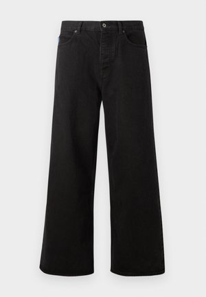 Zwarte denim broeken met wijde pijpen, een knoopsluiting, vijf zakken en contrasterende stiksels. Aan de voorkant zit een merketiket op de tailleband.