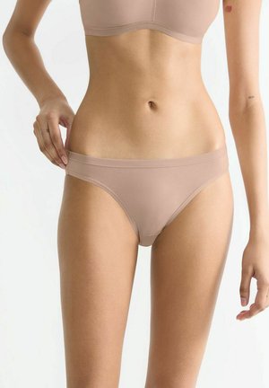 Light brown seamless bikini underwear with a smooth texture, low-rise design, and minimal coverage, suitable for everyday wear.