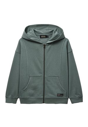Sweat à capuche vert avec fermeture éclair, poches avant, poignets côtelés et une étiquette "NEON EXPLORER" sur la partie inférieure de la poche.