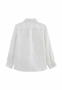 Chemise blanche à manches longues en lin, avec un col classique, des poignets boutonnés et un détail de empiècement au dos. Texture lisse.