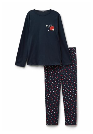 Haut à manches longues bleu marine avec un motif de coccinelle et de fleur, associé à des leggings bleu marine couverts de fleurs à pois rouges et blancs.