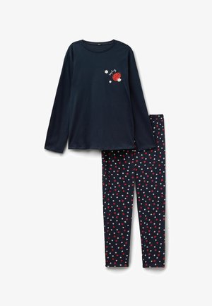 Top azul marino de manga larga con diseño de mariquita y flores, combinado con leggings azul marino cubiertos de flores de lunares rojos y blancos.