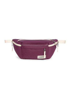 Violetti vyölaukku, jossa beige säädettävät hihnat, etutasku vetoketjulla ja Eastpakin logo edessä keskellä.