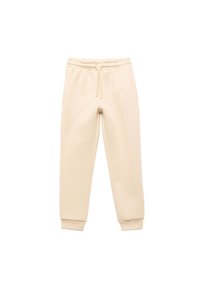 Beige bomulds sweatpants med snoretræk i taljen, ribbede manchetter og sidelommer. Glat tekstur, tapered fit, minimalistisk design.
