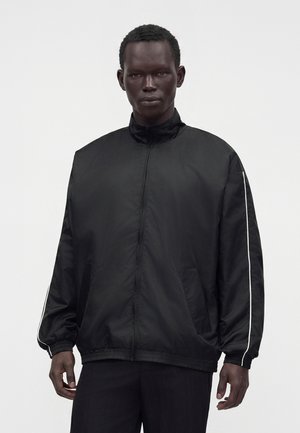 Essential Collective TRACK WINDBREAKER - Jakna za nošenje na otvorenom - black/navy