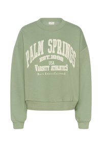 Sweatshirt vert avec des poignets et un ourlet côtelés. Présente un texte blanc : "PALM SPRINGS EST.1982 USA VARSITY ATHLETICS." Tissu doux, design cropped.