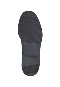 Semelle de chaussure en caoutchouc noir avec des rainures horizontales, une section triangulaire lisse et un logo circulaire marqué "37". Conception durable pour une adhérence et une stabilité.