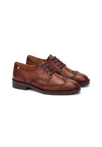 Chaussures habillées en cuir marron avec un design à bout fleuri, des perforations décoratives et un bout arrondi. Fini avec un petit talon empilé.