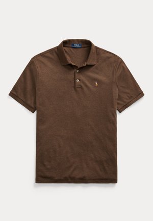 Brown cotton polo shirt with a classic collar, three-button placket, and a small embroidered logo on the left chest. Short sleeves.
